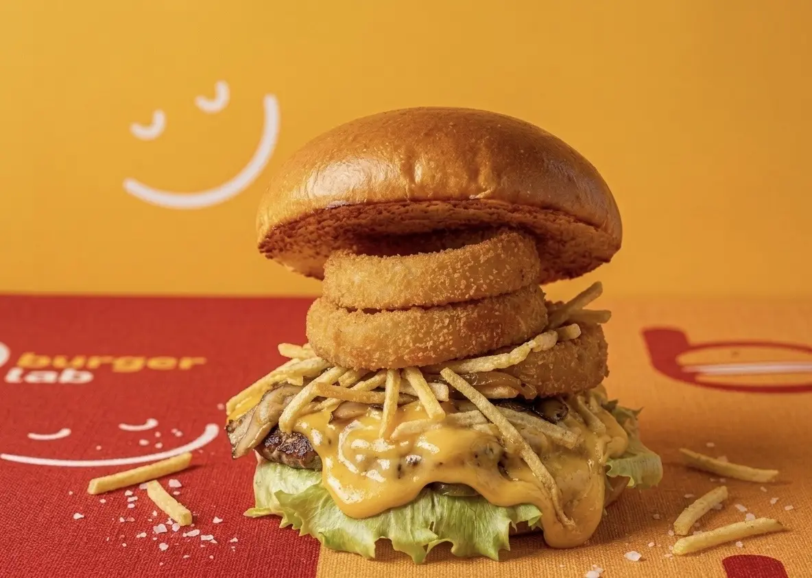 Chicken burger topped with onion rings